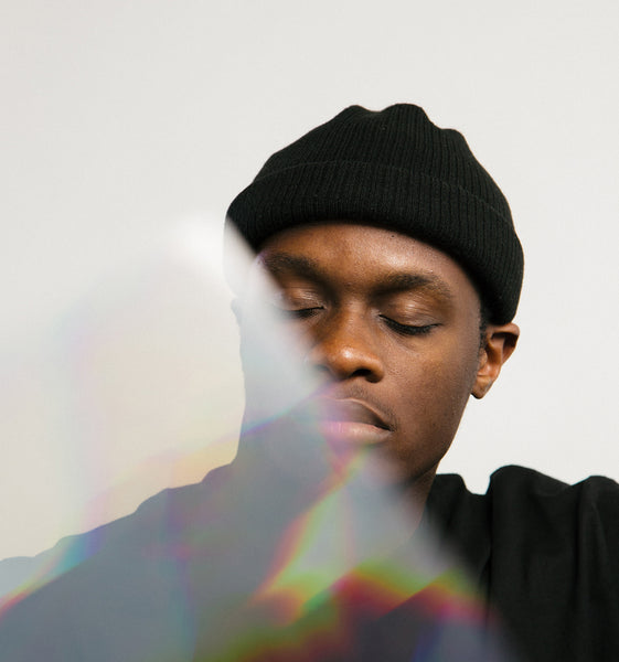 man with eyes closed as if sleeping