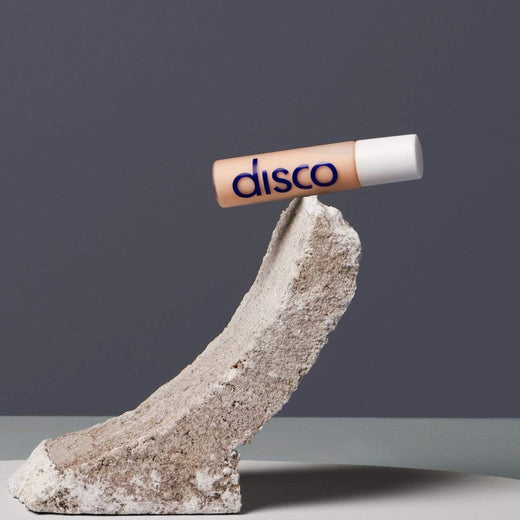 mens eye stick balancing on a piece of concrete